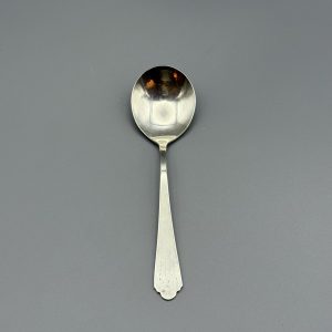 Sterling Silver Teaspoon Marked W in a circle with three lines shooting off from each side.